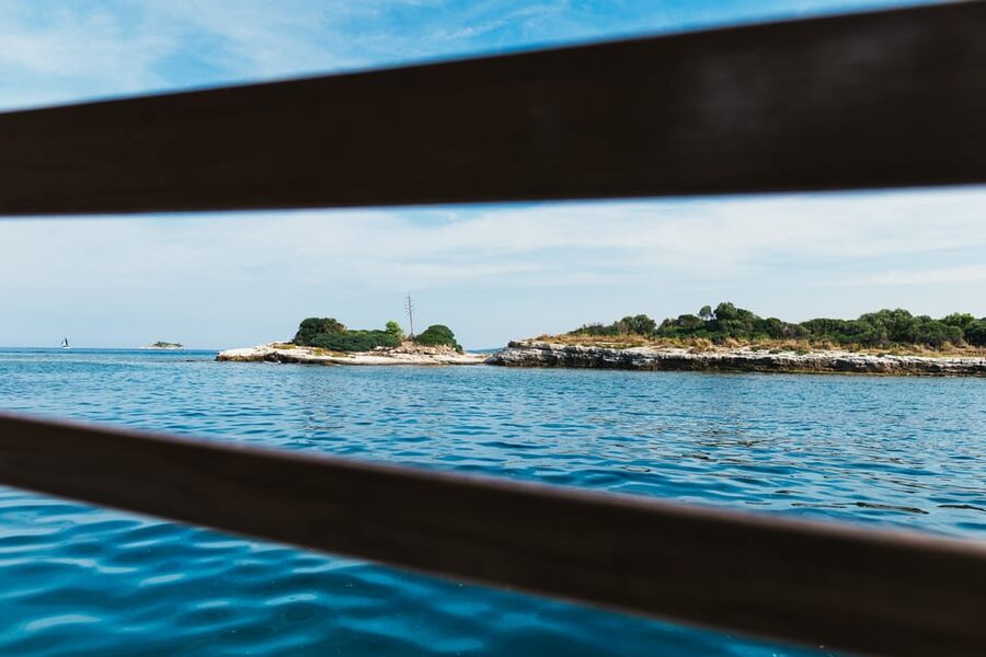 Rovinj: Sunset Cruise with Swim Stop, Drinks, and Fruits - Watching Rovinj turn gold from the water
