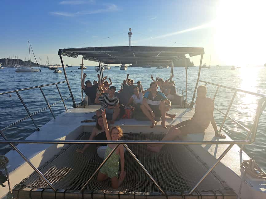 Rovinj: Sunset & dolphin group tours with Catamaran - Sunset views and Rovinj from the sea