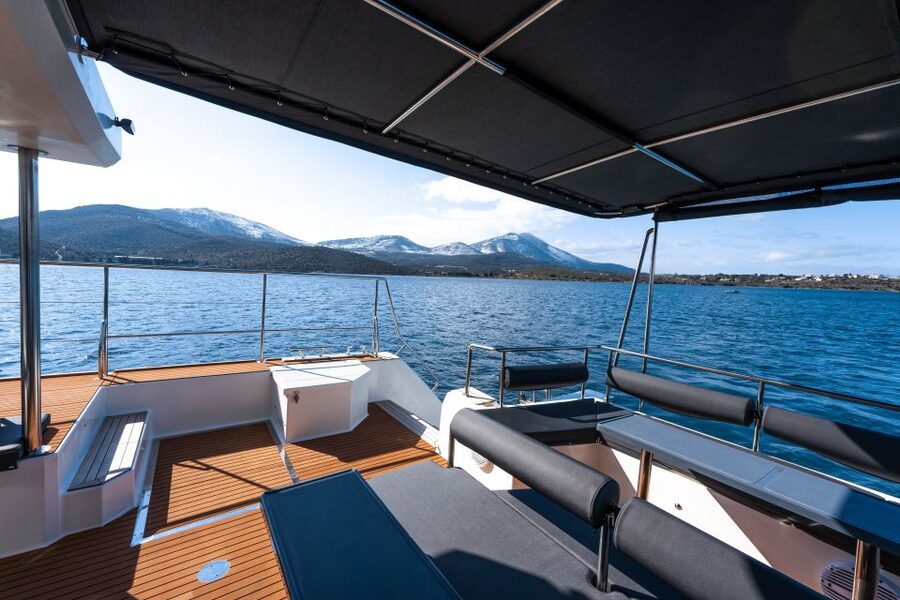 Santorini: Catamaran Caldera Cruise with Meal and Drinks - Sailing beneath Santorini’s caldera