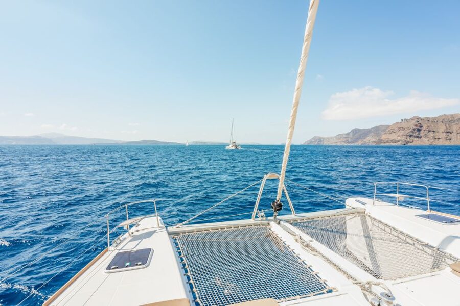 Santorini: Luxury Catamaran Day Trip with Meal and Open Bar - Hotel pickup and getting to the catamaran