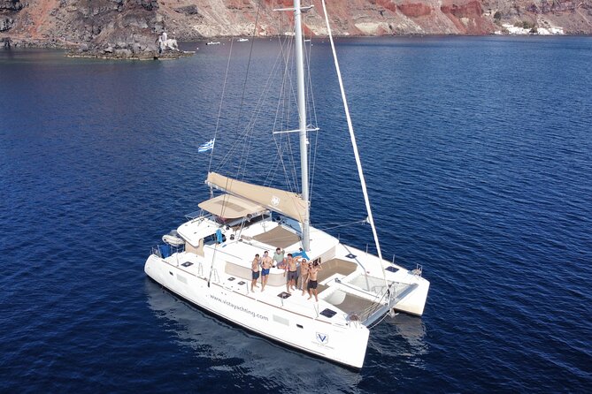 Santorini Platinum Catamaran Cruise with Meal, BBQ and Open Bar - Food, music, and crew service shape the experience