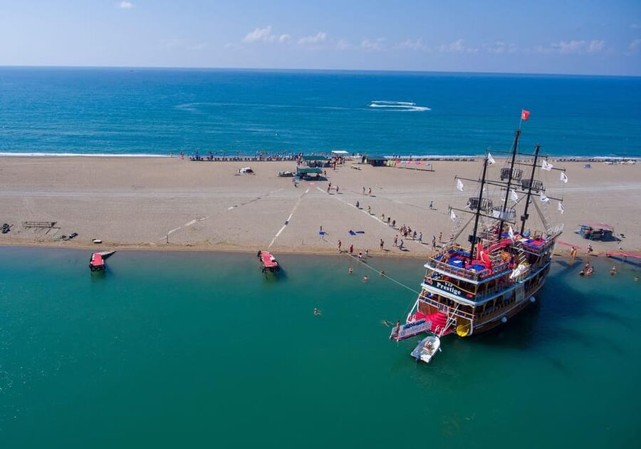 Side: Dolphin Island Boat Trip with Lunch & Unlimited Drinks - Swimming in clear water near the island