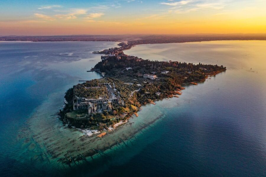 Sirmione: Sunset Boat Cruise with Local Wine - A sunset view of Sirmione that shore visitors miss