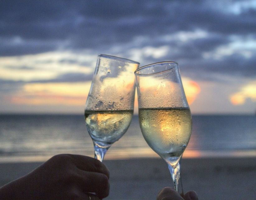 Sirmione: Sunset Boat Cruise with Local Wine - The first pass: harbor, spa, and Maria Callas’s villa