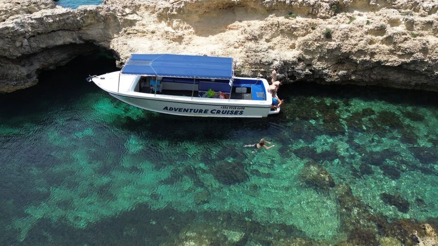 Sliema: Boat Trip to Comino Blue Lagoon, Gozo, and Caves - Comino’s caves from the powerboat