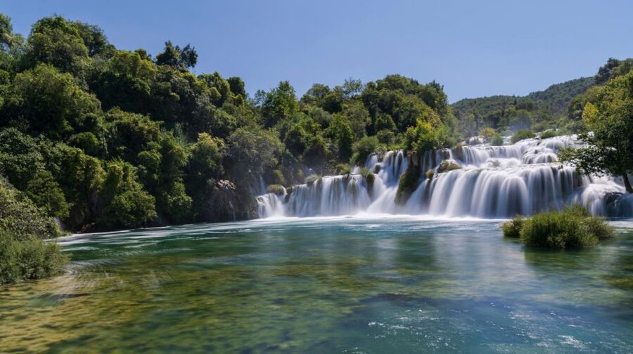 Split: Krka Waterfalls With Boat Cruise, Wine and Olive Oil - Walking the wooden paths at Skradinski buk
