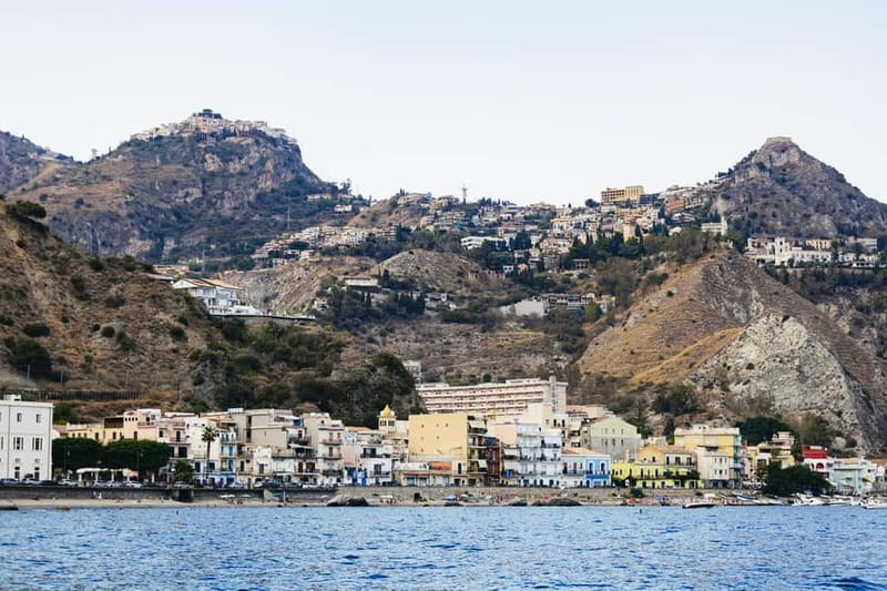 Taormina: Sunset Boat Tour with Dolphin Watching & Aperitif - Aperitif, snacks, and the return to port