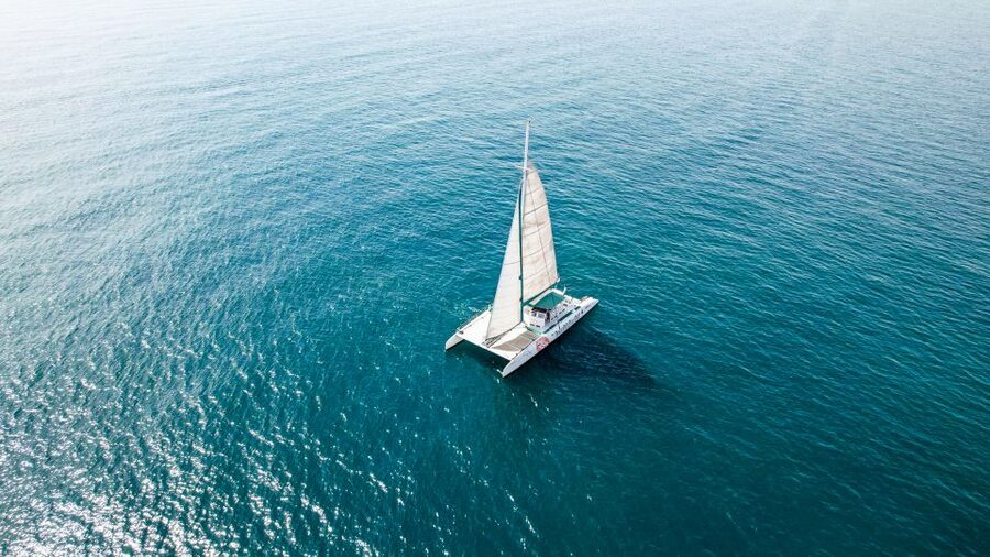 Valencia: Sailing Catamaran Cruise with Sunset Option and DJ - The catamaran, seats, nets, and onboard bar