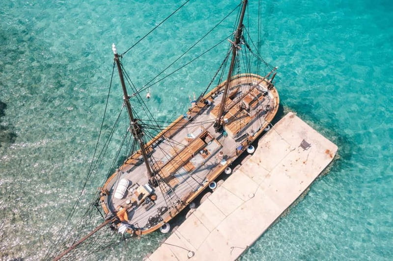 Zadar: Boat Tour with Unlimited Wine & 3 Stops - Boarding a 120-year-old wooden boat in Zadar