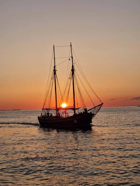 Zadar: Sunset Cruise on Traditional Boat with Wine - Boarding a 120-year-old wooden boat